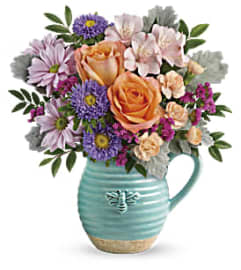 Busy Bee Pitcher Bouquet. An arrangement by Margaret's Florist.