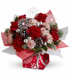 Teleflora's Snow Flurries Present Perfect. An arrangement by Pompano Beach Floral.