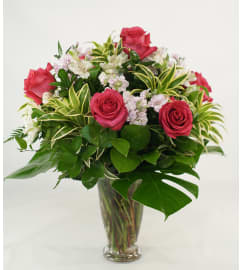 Tropical Romance with Pink Roses. An arrangement by Flower Fantasy Inc..
