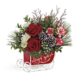 Teleflora's Dashing Sleigh Bouquet. An arrangement by Margaret's Florist.