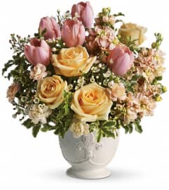 Teleflora's Peaches and Dreams. An arrangement by Margaret's Florist.