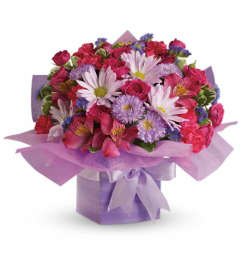 Teleflora's Lovely Lavender Present. An arrangement by Fort Lauderdale Florist.