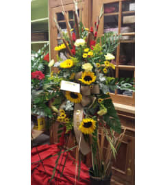 SUNFLOWER and CATTAIL EASEL. An arrangement by Gary's Floral Gallery.
