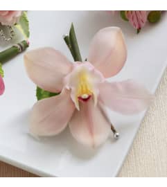 The FTD® Pink Cymbidium Boutonniere. An arrangement by Mystic Garden Floral.
