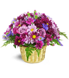 Amethyst Skies Basket™. An arrangement by Abundant Flowers and Gift Shoppe.