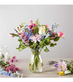 A Spring Tradition - A Florist Original. An arrangement by Country Cousins Flower Shop.