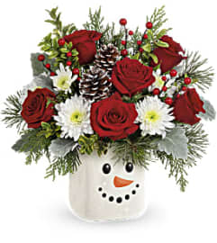 Teleflora's Smiling Snowman Bouquet. An arrangement by GardeLina Flowers.
