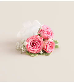 Pink Spray Rose Corsage. An arrangement by Flowers of Jacksonville.