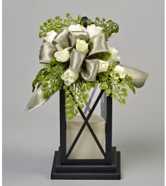 Tastefully Trimmed Lantern. An arrangement by Busse and Rieck Flowers Plants and Gifts.