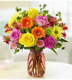 Confetti Bouquet™ in a Pink Vase. An arrangement by Blessing and Blooms Florist.