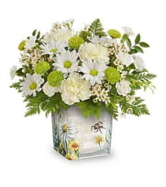 The Teleflora's Bee Sweet Bouquet. An arrangement by Marivel's Florist and Gifts.