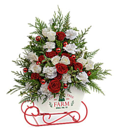 A Teleflora's Joyful Holiday Tree Bouquet. An arrangement by Marivel's Florist and Gifts.