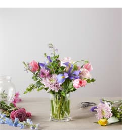 A Spring Tradition - A Florist Original. An arrangement by Country Cousins Flower Shop.