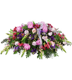 Tender Sentiments Casket Spray™. An arrangement by Abundant Flowers and Gift Shoppe.