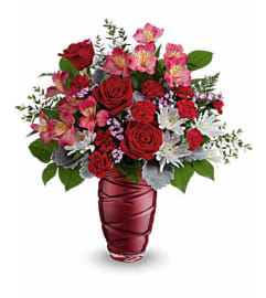 Teleflora's Loving Swirls Flower Bouquet. An arrangement by Margaret's Florist.