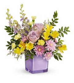 The Teleflora's Pastel Paradise Bouquet. An arrangement by Marivel's Florist and Gifts.