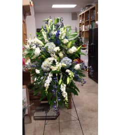BLUE and WHITE EASEL. An arrangement by Gary's Floral Gallery.