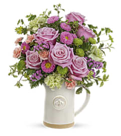 Teleflora's Artisanal Pitcher Bouquet. An arrangement by Marivel's Florist and Gifts.