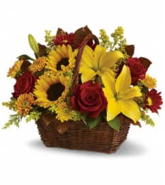 Golden Days Basket. An arrangement by Marivel's Florist and Gifts.