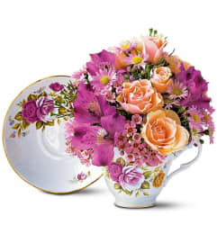 Pink Roses Teacup. An arrangement by Margaret's Florist.