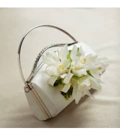 The FTD® White Purse Décor. An arrangement by Fink Flowers, Gifts and Flower Delivery.