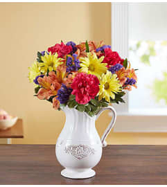Pitcher Perfect Flower Arrangement. An arrangement by Garden of Eden Floral.