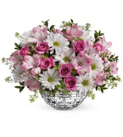 Teleflora's Facets Of Spring Centerpiece. An arrangement by Pompano Beach Floral.