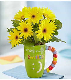 All Smiles™. An arrangement by Graceland Florist.