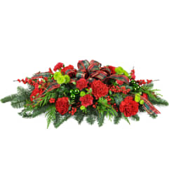 Christmas Traditions Centerpiece™. An arrangement by Always in Bloom Flower Shop.