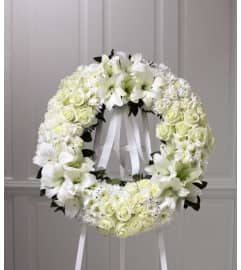 The FTD® Wreath of Remembrance™ in White. An arrangement by Mystic Garden Floral.