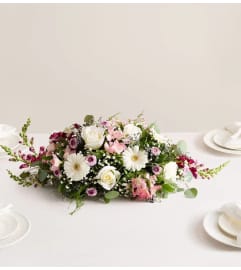 Romantic Blush™ Centerpiece. An arrangement by Sicola's Florist.