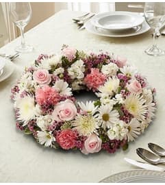 Pink and White Wreath Centerpiece. An arrangement by Blessing and Blooms Florist.