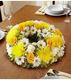 Yellow and White Centerpiece. An arrangement by Blessing and Blooms Florist.