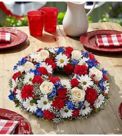 Red, White and Blue Centerpiece. An arrangement by Blessing and Blooms Florist.