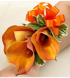 Golden Sunset Corsage. An arrangement by Blessing and Blooms Florist.