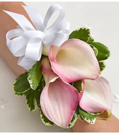 Pink Mini Calla Lily Corsage. An arrangement by Graceland Florist.