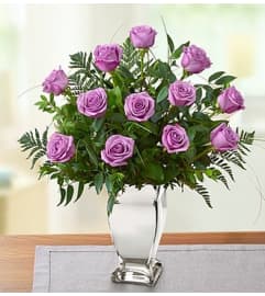 Premium Purple Roses in Silver Vase. An arrangement by Blessing and Blooms Florist.