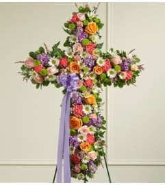 Pastel Mixed Flower Standing Cross. An arrangement by Blessing and Blooms Florist.