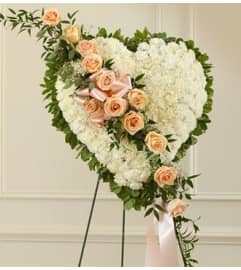 White Heart with Peach Rose Break. An arrangement by Graceland Florist.