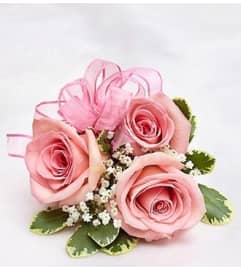 Pink Rose Corsage. An arrangement by Blessing and Blooms Florist.