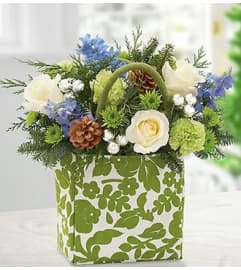 Heartfelt Holiday Handbag. An arrangement by Blessing and Blooms Florist.