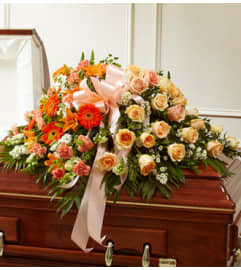 Cherished Memories Half Casket Cover-Peach and. An arrangement by Graceland Florist.