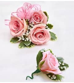 Pink Rose Corsage and Boutonniere. An arrangement by Blessing and Blooms Florist.