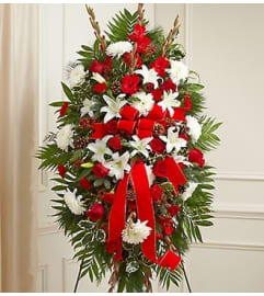 Sympathy Standing Spray in Christmas Colors. An arrangement by Graceland Florist.