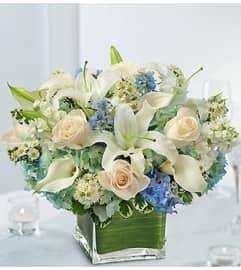 Blue and White Centerpiece in a Vase. An arrangement by Blessing and Blooms Florist.