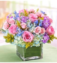 Pastel Centerpiece in a Vase. An arrangement by Graceland Florist.