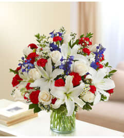 Sincerest Sorrow - Red, White and Blue. An arrangement by Blessing and Blooms Florist.