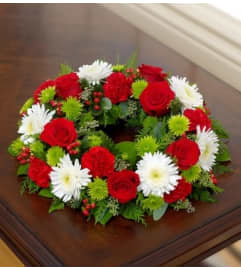 Cremation Wreath - Holiday. An arrangement by Graceland Florist.