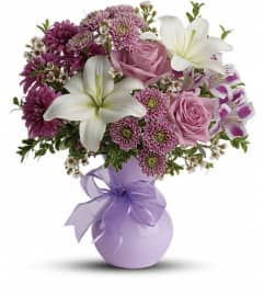 Teleflora's Precious in Purple. An arrangement by GardeLina Flowers.