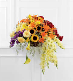 The FTD® Peaceful Tribute™ Basket Arrangement. An arrangement by Mystic Garden Floral.